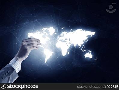Media worldwide technology concept. Man hand holding digital world map representing global technologies concept