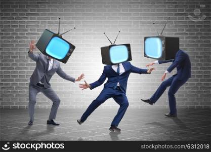 Media zombie concept with man and tv set instead of head. The media zombie concept with man and tv set instead of head