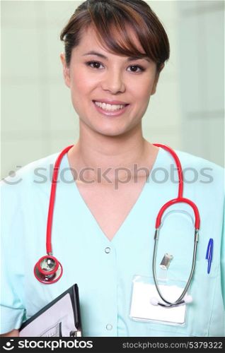 Medic in scrubs with a stethoscope and clipboard