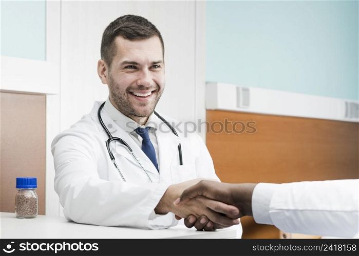 medic man shaking hand colleague