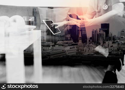 Medical and Health context,doctor hand working with smart phone,digital tablet computer,stethoscope,sitting on sofa in living room,London architecture city