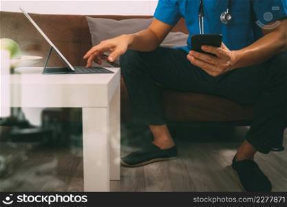 Medical and Health context,doctor hand working with smart phone,digital tablet computer,stethoscope,sitting on sofa in living room,filter