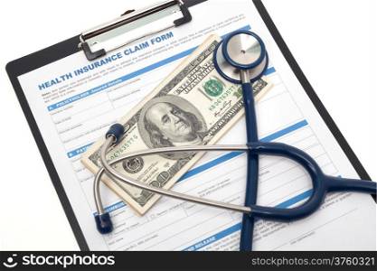 Medical and health insurance claim form with stethoscope on clipboard isolated