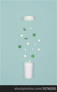 Medical background with pills. White and green pills pour out of a bottle on a blue background. Flat lay concept.. Medical background with pills and bottle.