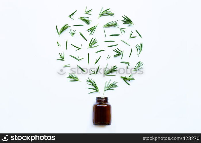 Medical bottle glass with fresh rosemary leaves isolated on white background. Heart shape