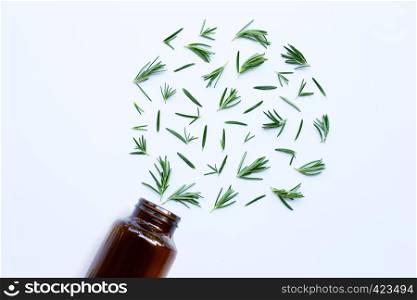 Medical bottle glass with fresh rosemary leaves isolated on white background. Heart shape