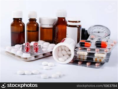 Medical bottles with medical ampoules and tablets. Medicine bottles and pills close up