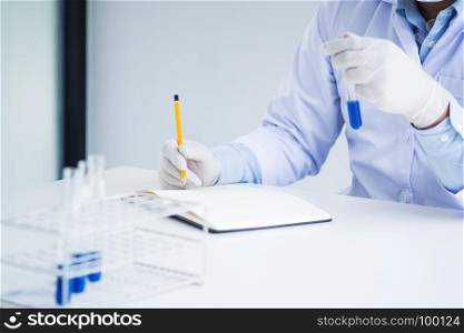 medical chemist / scientist student experiments test tube in laboratory