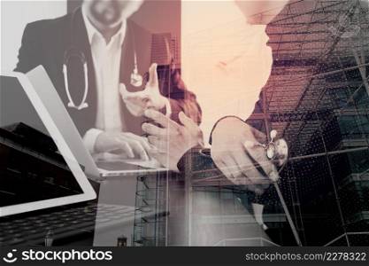 Medical co working concept,Doctor working with digital tablet and laptop computer formeeting his team in modern office at hospital with London city exposure