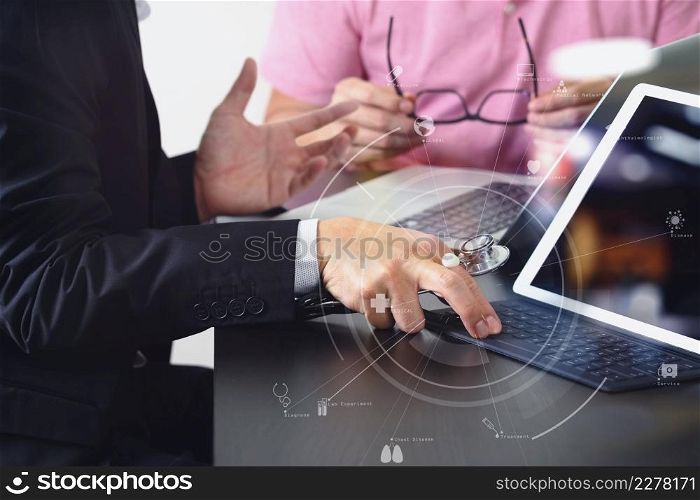 Medical co working concept,Doctor working with smart phone and digital tablet and laptop computer to meeting his team in modern office at hospital with virtual icon diagram