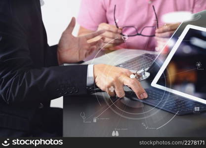 Medical co working concept,Doctor working with smart phone and digital tablet and laptop computer to meeting his team in modern office at hospital with virtual icon diagram