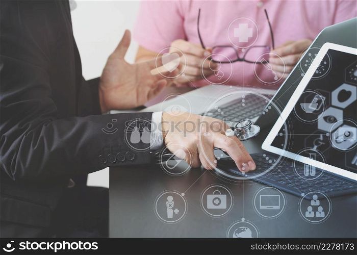 Medical co working concept,Doctor working with smart phone and digital tablet and laptop computer to meeting his team in modern office at hospital with virtual icon diagram