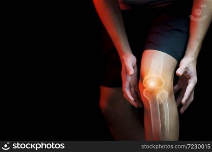 Medical concept, man suffering with knee painful - skeleton x-ray,