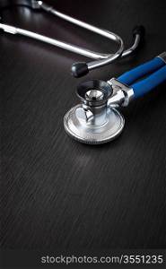 medical concept with beautiful stethoscope on black background, selective focus