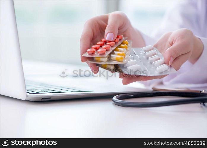 Medical concept with medicines and laptop computer