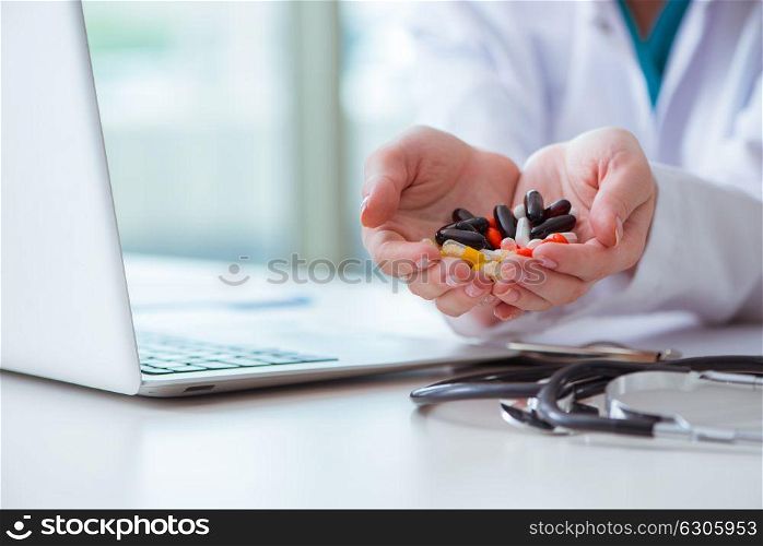 Medical concept with medicines and laptop computer