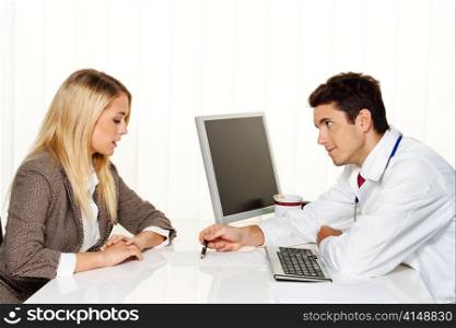 medical consultation. patient and doctor talking to a doctor&acute;s office