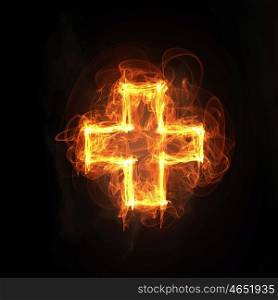 Medical cross icon. Glowing light cross sign on dark background