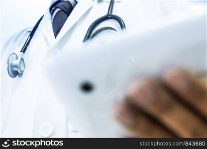Medical doctor consulting patient's health online using digital tablet.Professional emergency healthcare assistance service concept