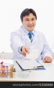 Medical doctor giving prescription