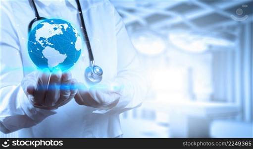 Medical Doctor holding a world globe in his hands as medical network concept