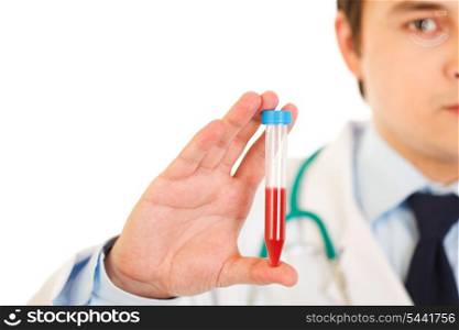 Medical doctor holding blood sample in hand isolated on white. Close-up.&#xA;