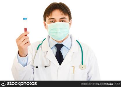 Medical doctor in mask holding blood sample in hand isolated on white&#xA;