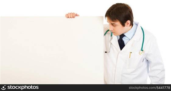 Medical doctor looking at blank billboard isolated on white&#xA;