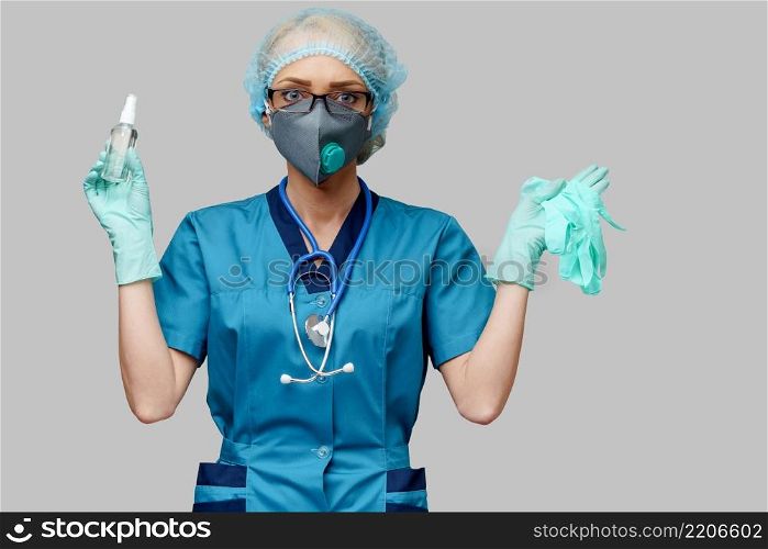 medical doctor nurse wearing protective mask - holding bottle of sanitizing spray or gel.. medical doctor nurse wearing protective mask - holding bottle of sanitizing spray or gel