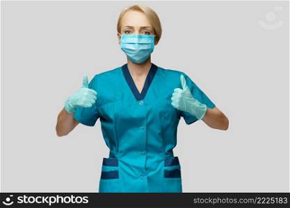 medical doctor nurse woman wearing protective mask and latex gloves - showing big thumb up.. medical doctor nurse woman wearing protective mask and latex gloves - showing big thumb up
