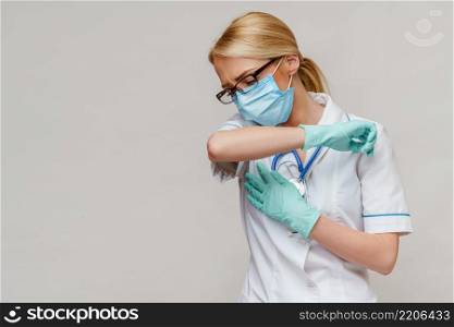 medical doctor nurse woman wearing protective mask and rubber or latex gloves - cough.. medical doctor nurse woman wearing protective mask and rubber or latex gloves - cough