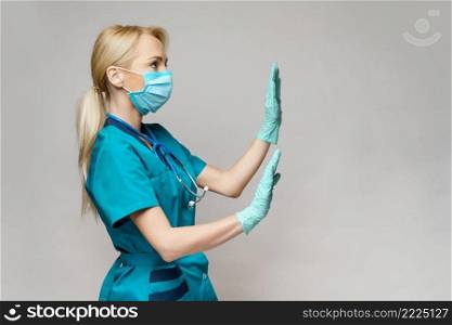 medical doctor nurse woman wearing protective mask and rubber or latex gloves - scared and stressed.. medical doctor nurse woman wearing protective mask and rubber or latex gloves - scared and stressed
