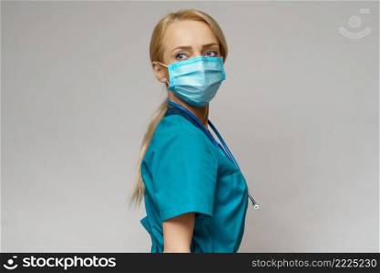 medical doctor nurse woman with stethoscope over light grey background - wearing protective mask and rubber or latex gloves.. medical doctor nurse woman with stethoscope wearing protective mask and rubber or latex gloves