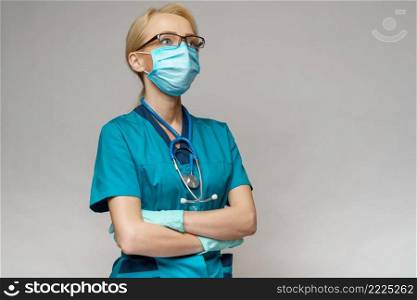 medical doctor nurse woman with stethoscope over light grey background - wearing protective mask and rubber or latex gloves.. medical doctor nurse woman with stethoscope wearing protective mask and rubber or latex gloves