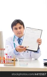 Medical doctor stretching clipboard for you to sign