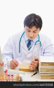 Medical doctor studying books