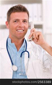 Medical doctor talking on phone at office.