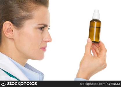 Medical doctor woman looking on medicine bottle
