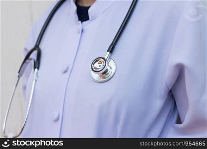 Medical doctor woman or physician in white gown uniform with stethoscope in hospital or clinic