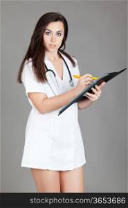 medical doctor woman with stethoscope. A female doctor with a folder
