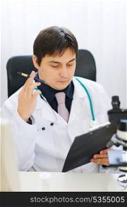 Medical doctor working at office