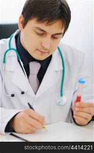 Medical doctor working with blood sample
