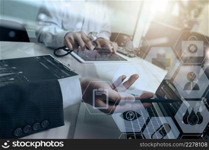 medical doctor working with smart phone and digital tablet computer with stethoscope and  eyeglass on marble desk with virtual graphic interface icons screen as concept