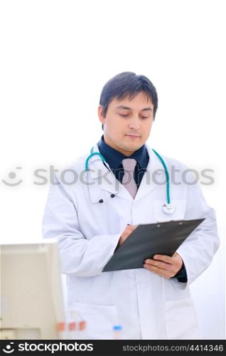 Medical doctor writing something in clipboard&#xA;