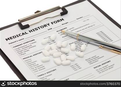 Medical document with pills and pen