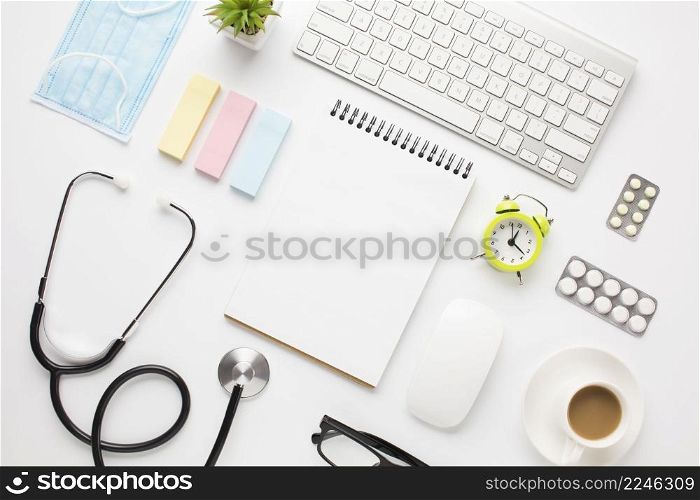 medical equipment office supplies with coffee cup doctor desk