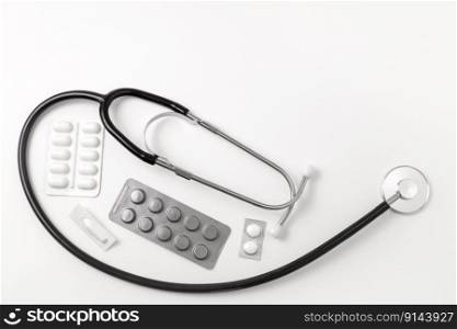 Medical equipment on white background. Stethoscope, pills, tablets. Medical tools. Medicine and healthcare. Free space for text, copy space. Medical equipment on white background. Stethoscope, pills, tablets. Medical tools. Medicine and healthcare. Free space for text, copy space.