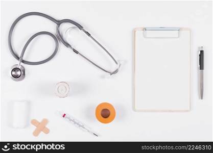 medical equipments with clipboard pen white background