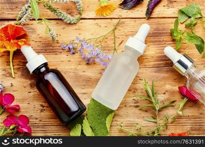 Medical essential oils of flowers and herbs.Herbal essence. Bottle with herb essential oil