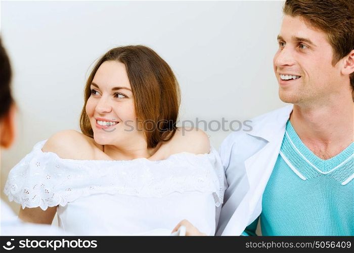 Medical examination. Young pregnant woman examined by doctor at ultrasound check